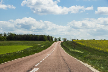 Country road with blue sky in Northern France