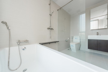 Toilet bowl in modern bathroom interior