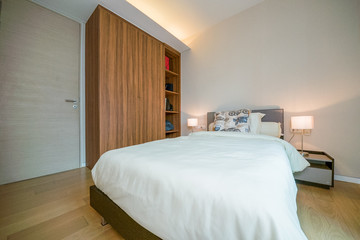 Luxury bedroom interior with large comfortable bed. Space for text 