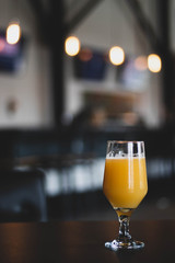 glass of beer on wooden table