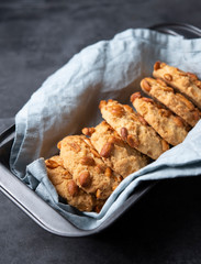 cookies with nuts on baking dish gray background close up