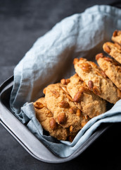 cookies with nuts on baking dish gray background close up
