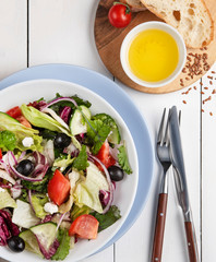 fresh greek salad with feta and olives leaf bread and tomato cherry summer food vagatables diet vitamin vegan natural
