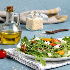 fresh green salad with tomato cherry ruccola and mozarela olive oil and seasame vegan food diet