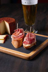 cured ham with fuerteventura pepper cheese and beer