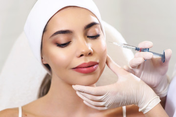 Beautician doctor cosmetologist at work. Biorevitalization cosmetology injection. Face skin treatment hyaluronic acid. Beauty facial filling. Filler. Botox procedure. Healthcare beauty concept