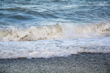 Colorful seascape, view of sea waves on beach close up