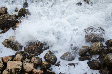 Seascape of dramatic storm, sea waves on wild rocky seashore