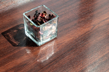 Drying Flower in glass on Table decoration with the sunlight. wooden background with decorative item objects
