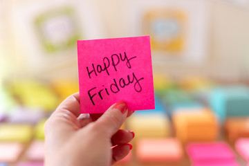 Happy Friday on pink sticky note