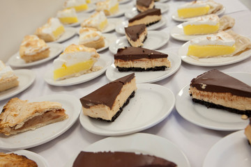 Assorted pies on plates at a party