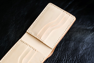 Genuine leather bifold card bill wallet on black