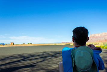 Man looking down the road