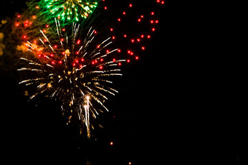 Fototapeta premium Firework display lighting up the night sky in Grand Rapids Michigan
