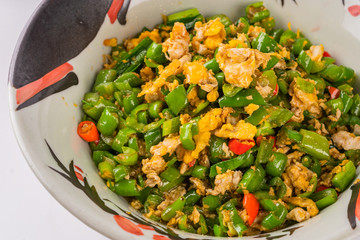 A dish of spicy Hunan cuisine in white background