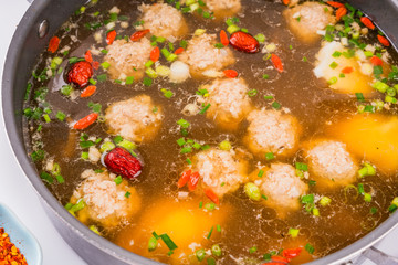 A dish of spicy Hunan cuisine in white background