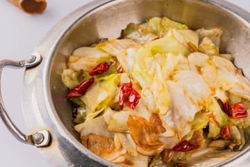 A dish of spicy Hunan cuisine in white background
