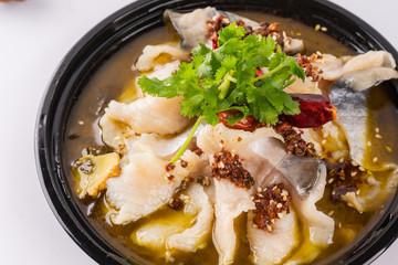 A dish of spicy Hunan cuisine in white background