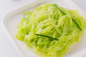 A dish of spicy Hunan cuisine in white background