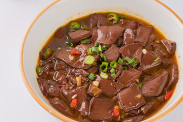 A dish of spicy Hunan cuisine in white background