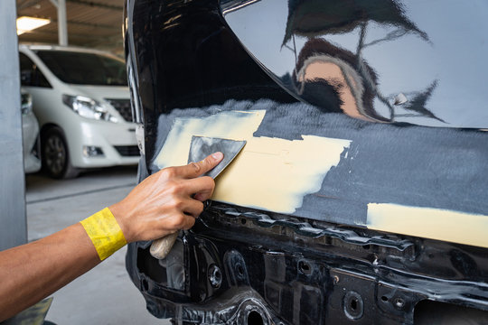 Auto Body Repair Series : Applying Putty Filler Stock Photo, Picture and  Royalty Free Image. Image 75444990.