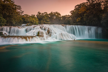 Beautiful sunset over the turquoise waterfalls at Agua Azul in Chiapas, Mexico