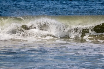 empty wave crashing in the ocean 