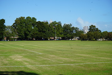 an empty park with a soccer field