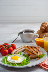 Fried eggs with sausages plate