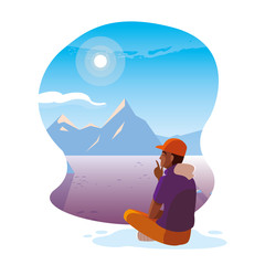 afro man seated observing snowscape nature