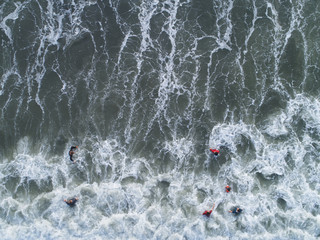 Aerial view. People swimming at the sea.