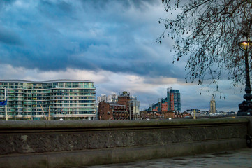 London buildings on the river thames and trees