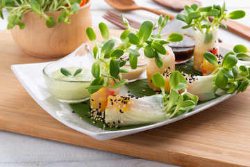 Rice paper salad rolls with carrot,sunflower sprout, corn and crab stick