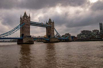 London skyline on the river thames with dark clouds