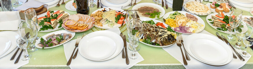 Beautiful festive table. A lot of tasty food.
