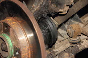 Usable brake disk and damaged CV joint duster - repair car suspension and gear drive on left side