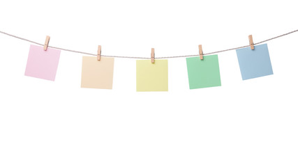 Five paper blank notes hanging on the rope isolated on white background