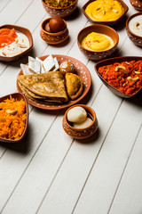 group of Indian Sweet / mithai in terracotta bowl