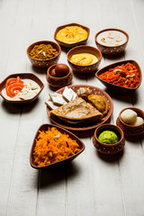 group of Indian Sweet / mithai in terracotta bowl