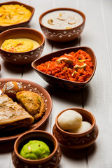 group of Indian Sweet / mithai in terracotta bowl