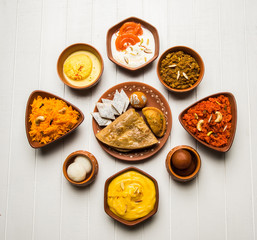 group of Indian Sweet / mithai in terracotta bowl