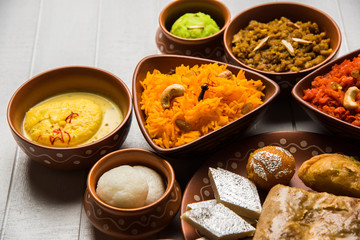 group of Indian Sweet / mithai in terracotta bowl