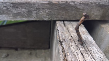 old wooden with nail on