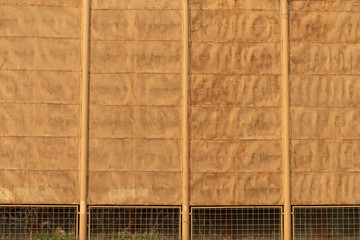 background texture of old yellow fence made of metal sheets