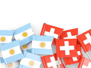 Pins with flags of Argentina and switzerland isolated on white.