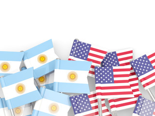 Fototapeta na wymiar Pins with flags of Argentina and United States isolated on white.