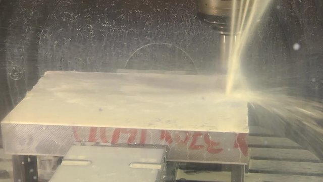 Finishing metal working on high precision grinding machine in workshop.  industrial metal machining cutting process of blank detail by milling cutter with hardmetal carbide insert