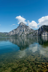 Fototapeta na wymiar Traunstein Mountain reflection and clear water in Lake Traunsee, Austria
