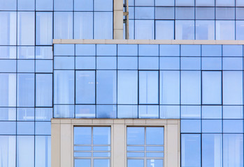 The walls of the house of plastic panels and glass as a background