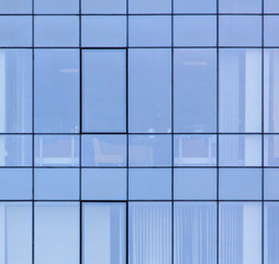 The walls of the house of plastic panels and glass as a background